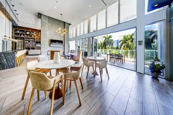 Modern clubhouse with vibrant decor at Alluvion Las Olas Apartments, offering luxury living spaces in Fort Lauderdale