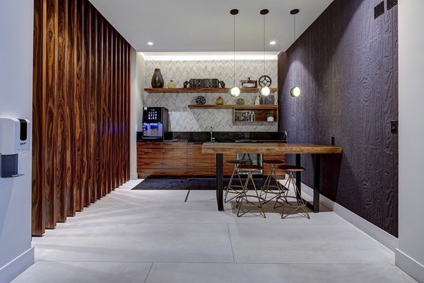 Clubhouse featuring modern design and chic furnishings at Alluvion Las Olas Apartments in Fort Lauderdale, promoting luxury living