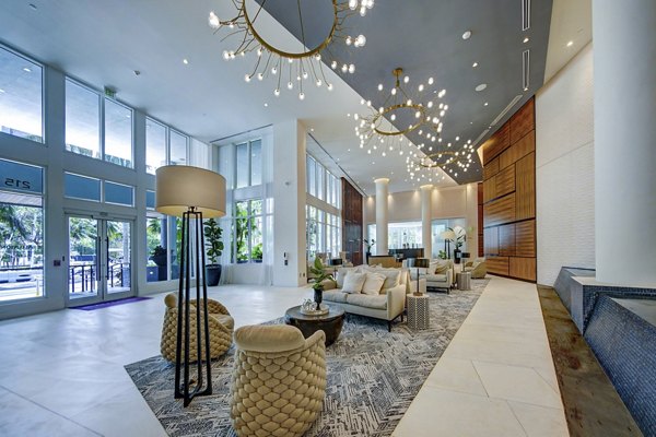 Clubhouse with modern decor and entertainment area at Alluvion Las Olas Apartments