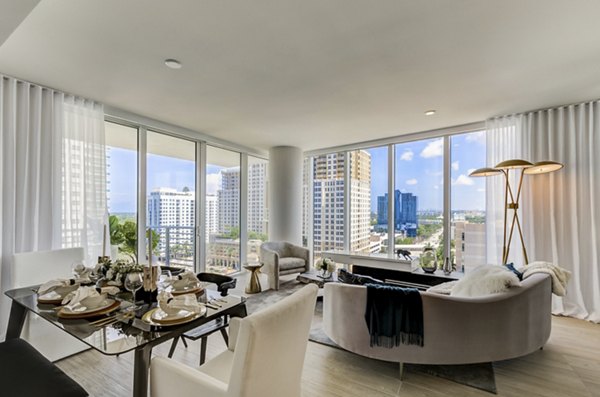 Elegant living room with chic furnishings at Alluvion Las Olas Apartments, offering luxury living spaces