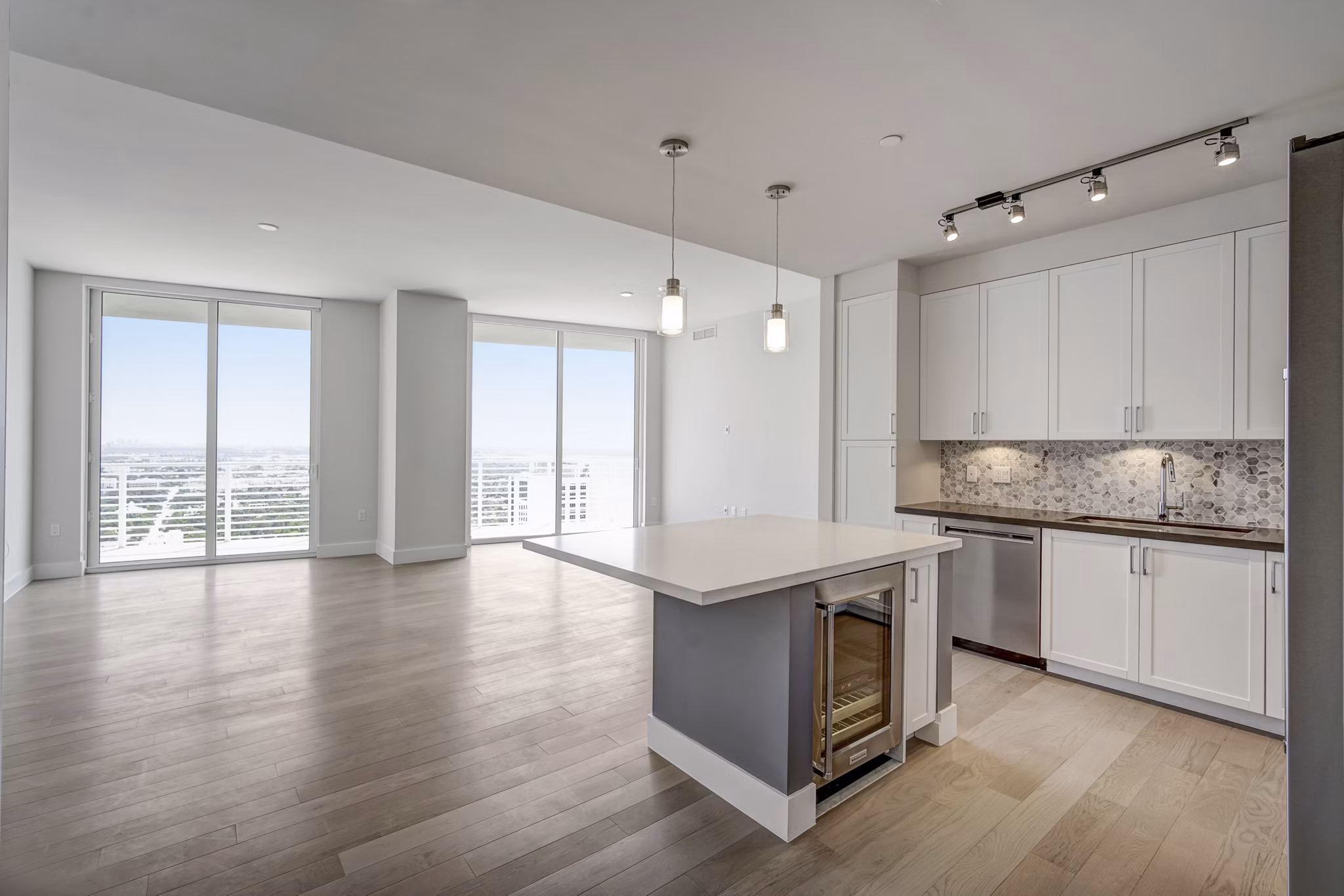 Modern kitchen with sleek countertops and stainless steel appliances at Alluvion Las Olas Apartments