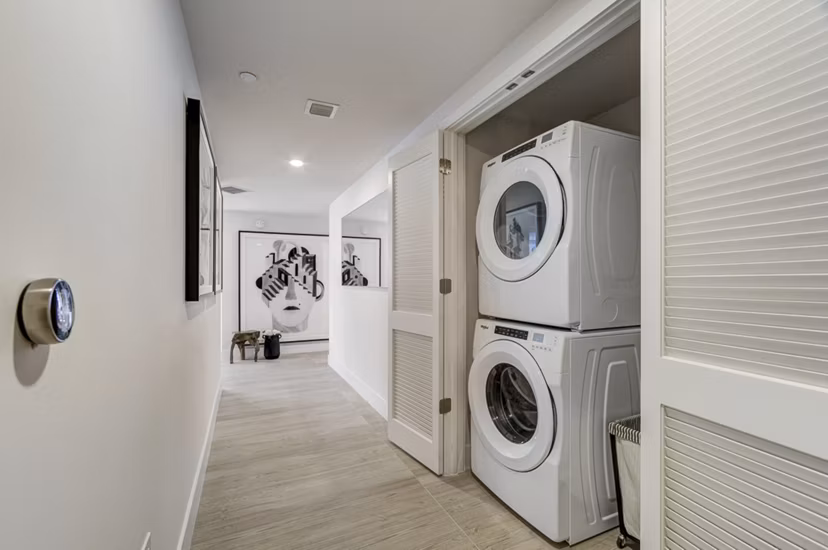Modern laundry room with high-efficiency washers and dryers at Drexler Townhomes in Holbrook Farms
