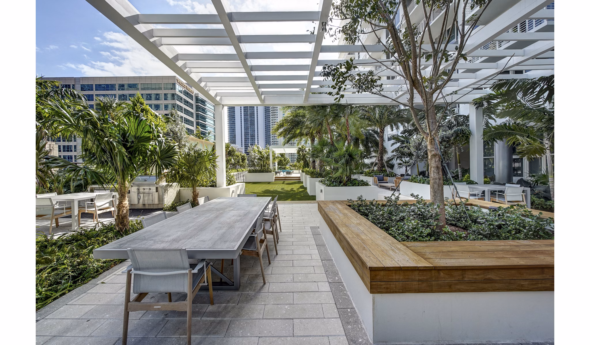 Tranquil courtyard with lush landscaping at Alluvion Las Olas Apartments in Fort Lauderdale