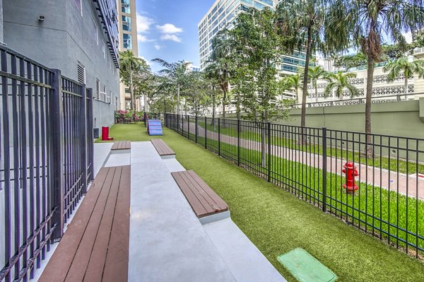 Dog park with agility equipment at Alluvion Las Olas Apartments