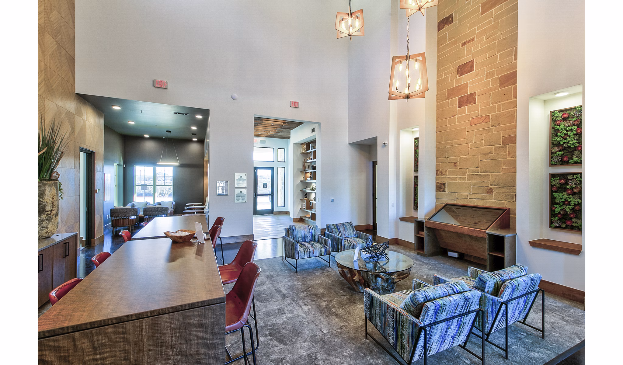 The Preserve: Elegant clubhouse lobby with contemporary furnishings and high ceilings at Greystar luxury apartments