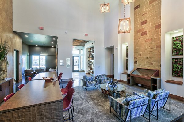 The Preserve: Elegant clubhouse lobby with contemporary furnishings and high ceilings at Greystar luxury apartments