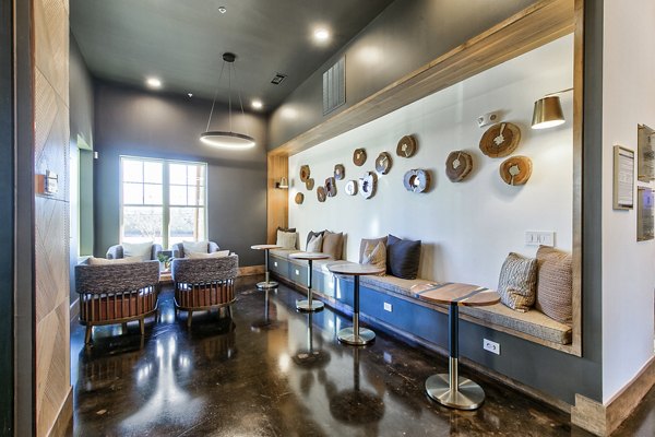 Clubhouse lobby featuring modern decor and seating at The Preserve apartments