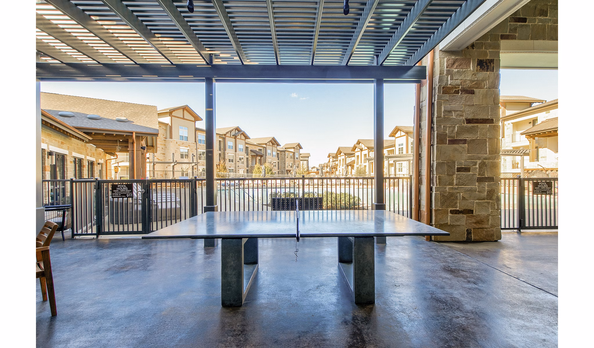 Modern game room with pool table and arcade games at The Preserve luxury apartments