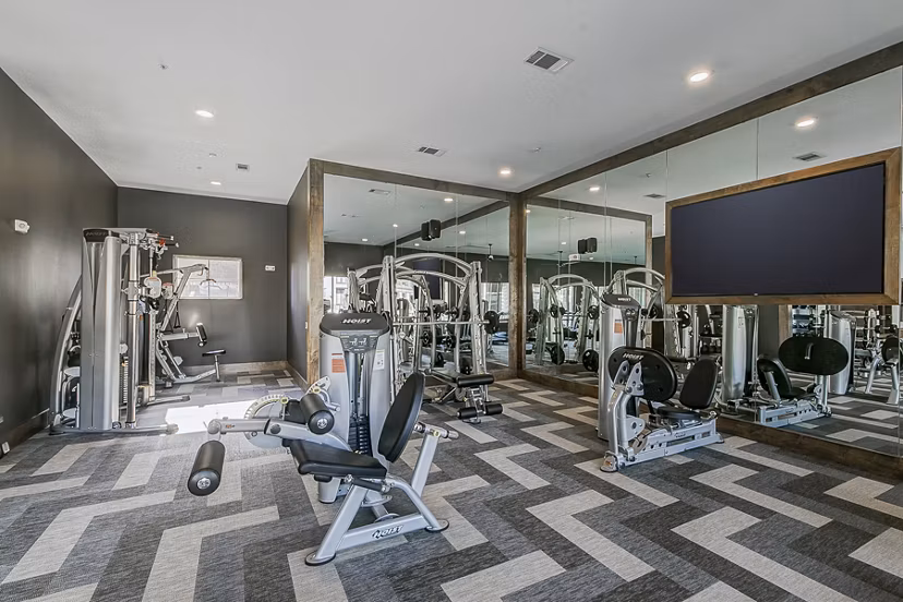 Modern fitness center with state-of-the-art equipment at The Preserve luxury apartments
