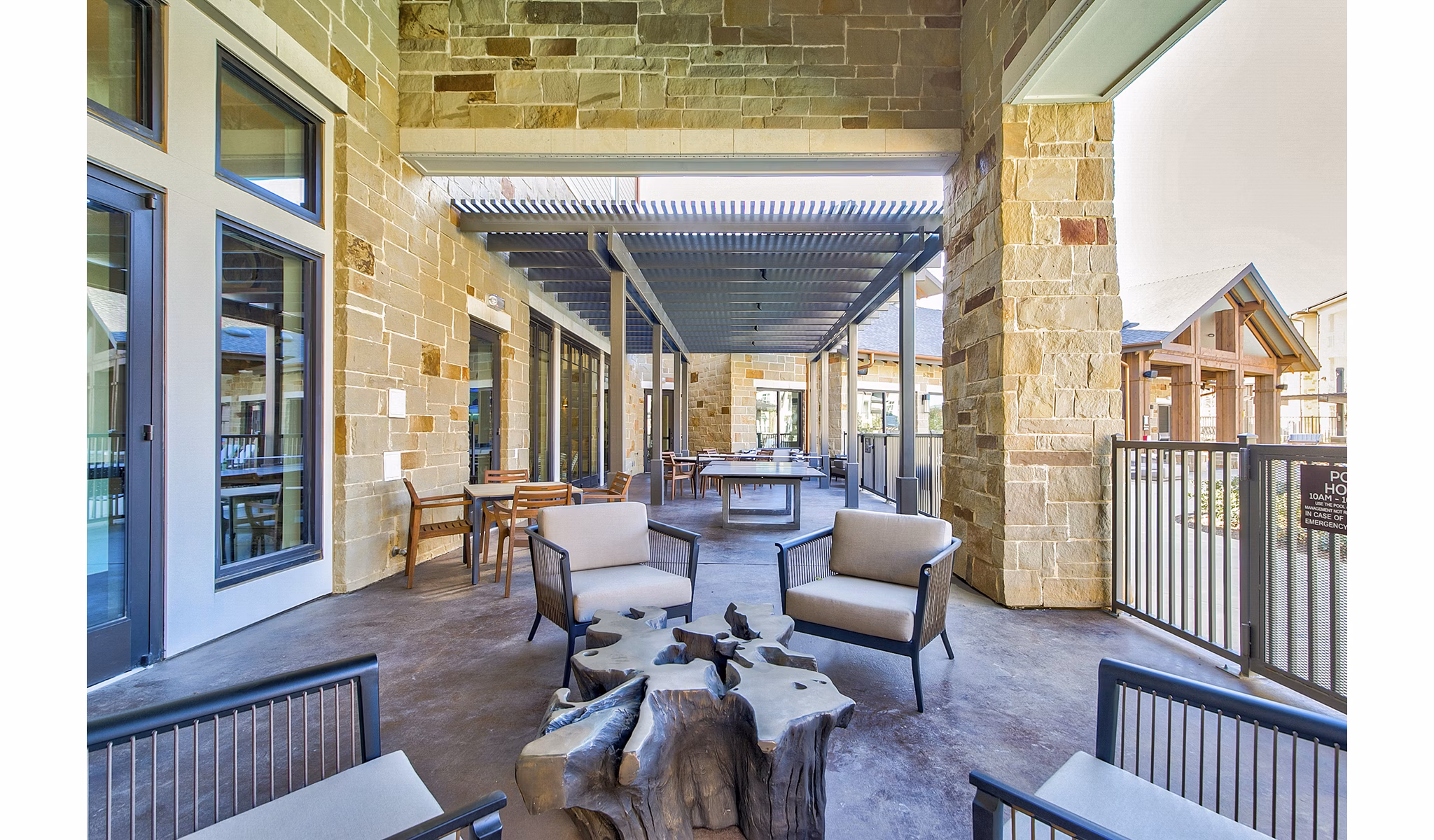 Patio with stylish seating and garden views at The Preserve luxury apartments