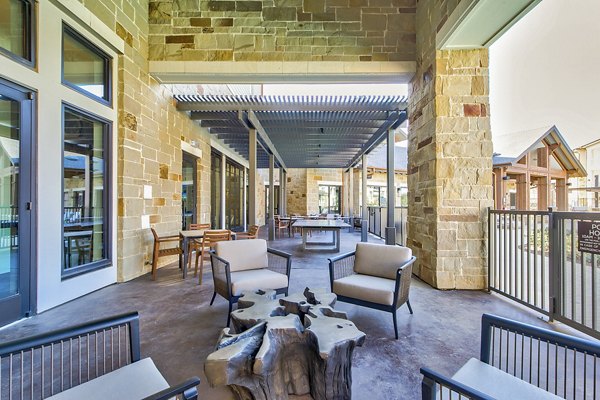 Patio with stylish seating and garden views at The Preserve luxury apartments