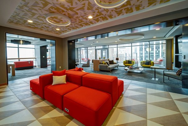 Clubhouse featuring sleek design and modern furnishings at 511 Faye Apartments