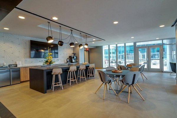 Modern clubhouse with sleek design and comfortable seating at 511 Faye Apartments, perfect for social gatherings and relaxation