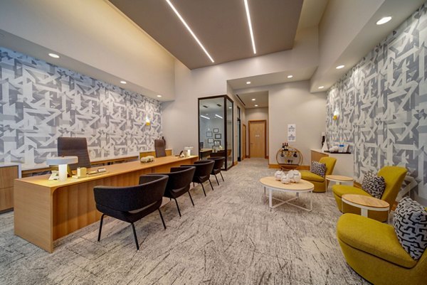 Clubhouse at 511 Faye Apartments with stylish seating areas and contemporary design in Greystar luxury apartments