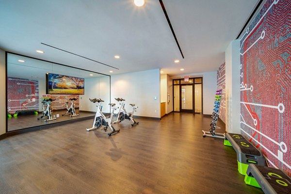 Modern fitness center with state-of-the-art equipment at 511 Faye Apartments