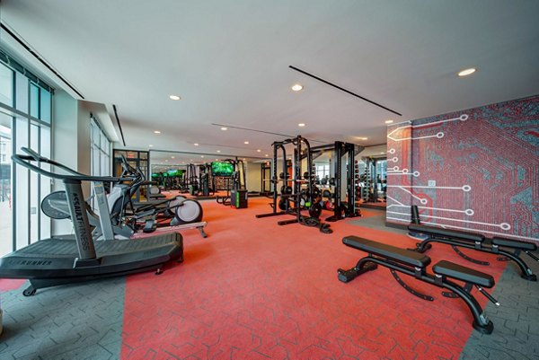 State-of-the-art fitness center with modern equipment at 511 Faye Apartments, perfect for luxury living and wellness