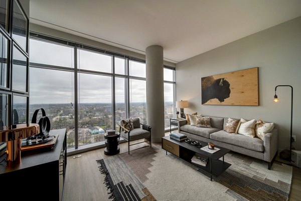 Spacious living room with modern furnishings in 511 Faye Apartments, offering luxury living near top Seattle attractions