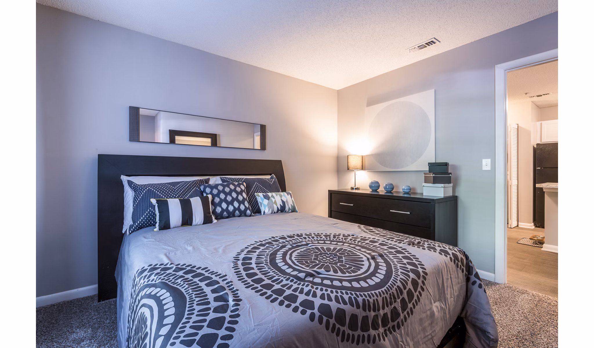 Cozy bedroom with contemporary dÃ©cor at Bridgeport Apartments