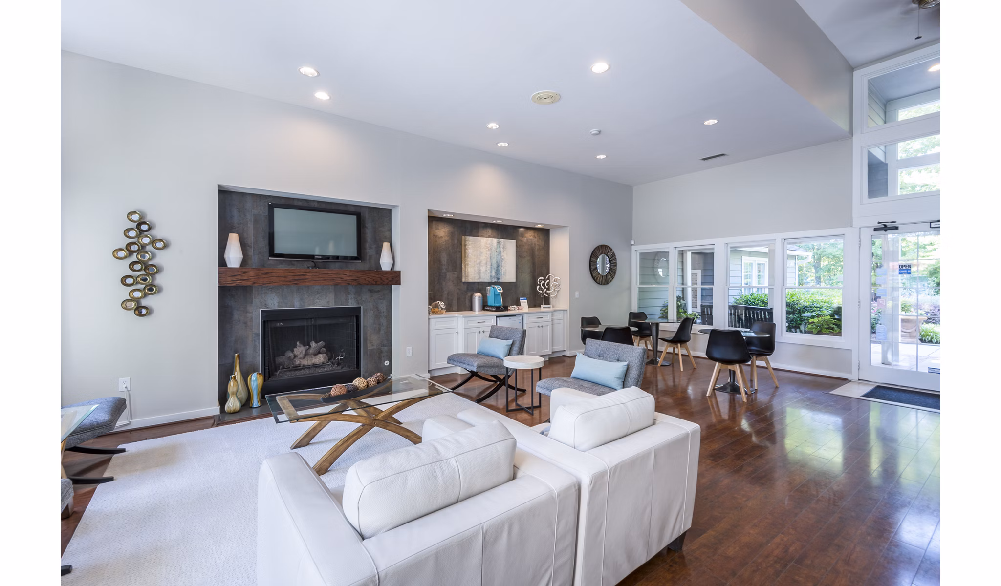Clubhouse featuring modern design and spacious seating at Bridgeport Apartments, luxury community by Greystar