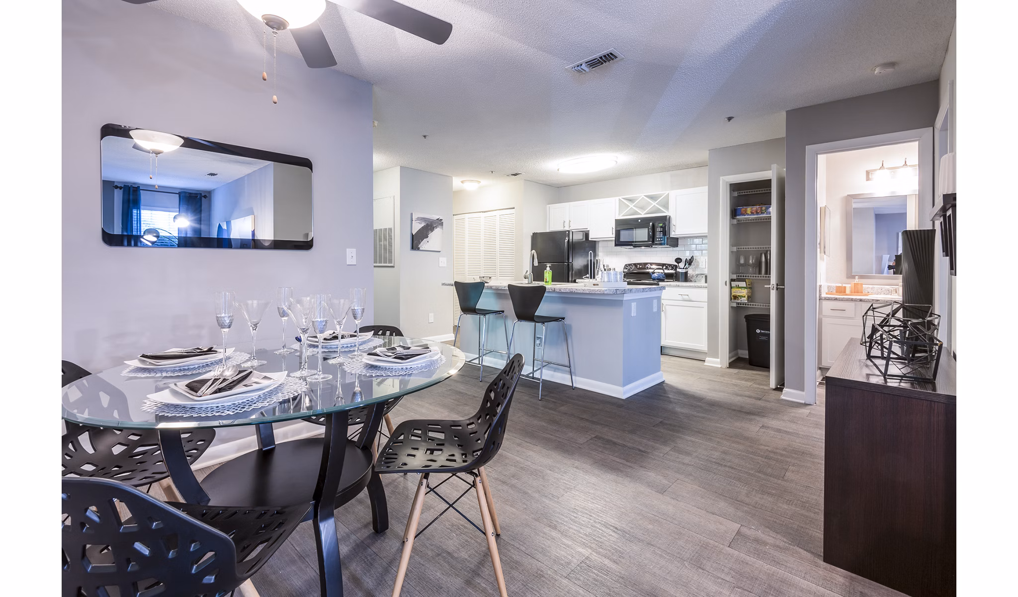 Dining room featuring elegant table setting and modern lighting at Bridgeport Apartments, luxury living by Greystar