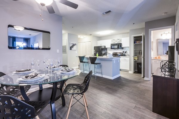 Dining room featuring elegant table setting and modern lighting at Bridgeport Apartments, luxury living by Greystar