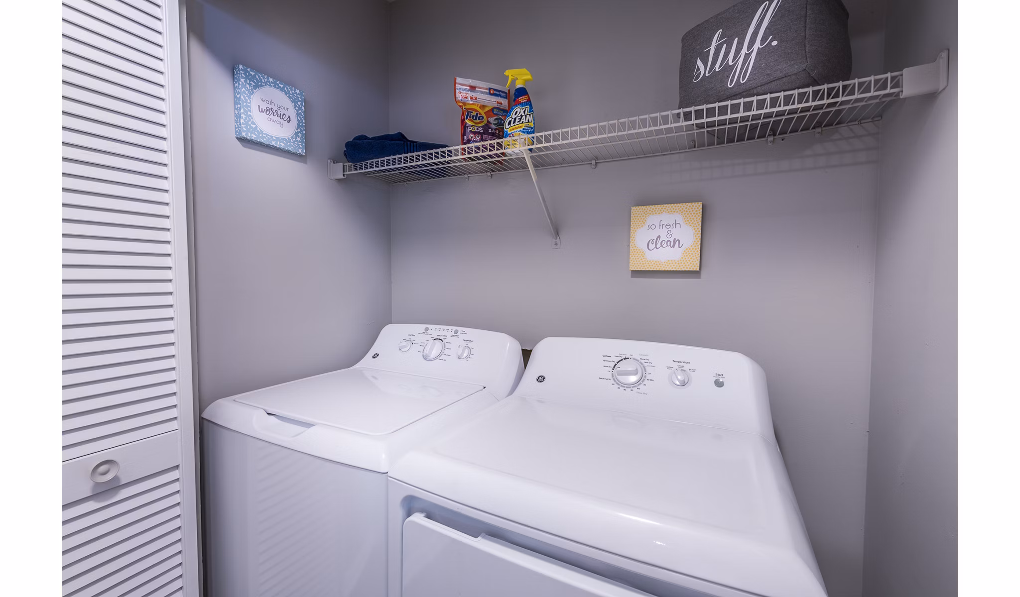 Laundry room with modern appliances in Bridgeport Apartments for convenient living
