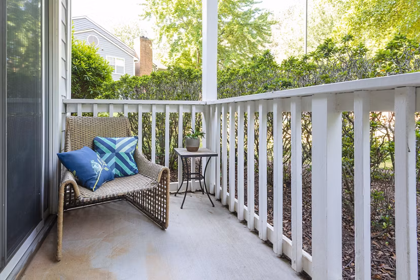 Private patio with modern furniture at Bridgeport Apartments