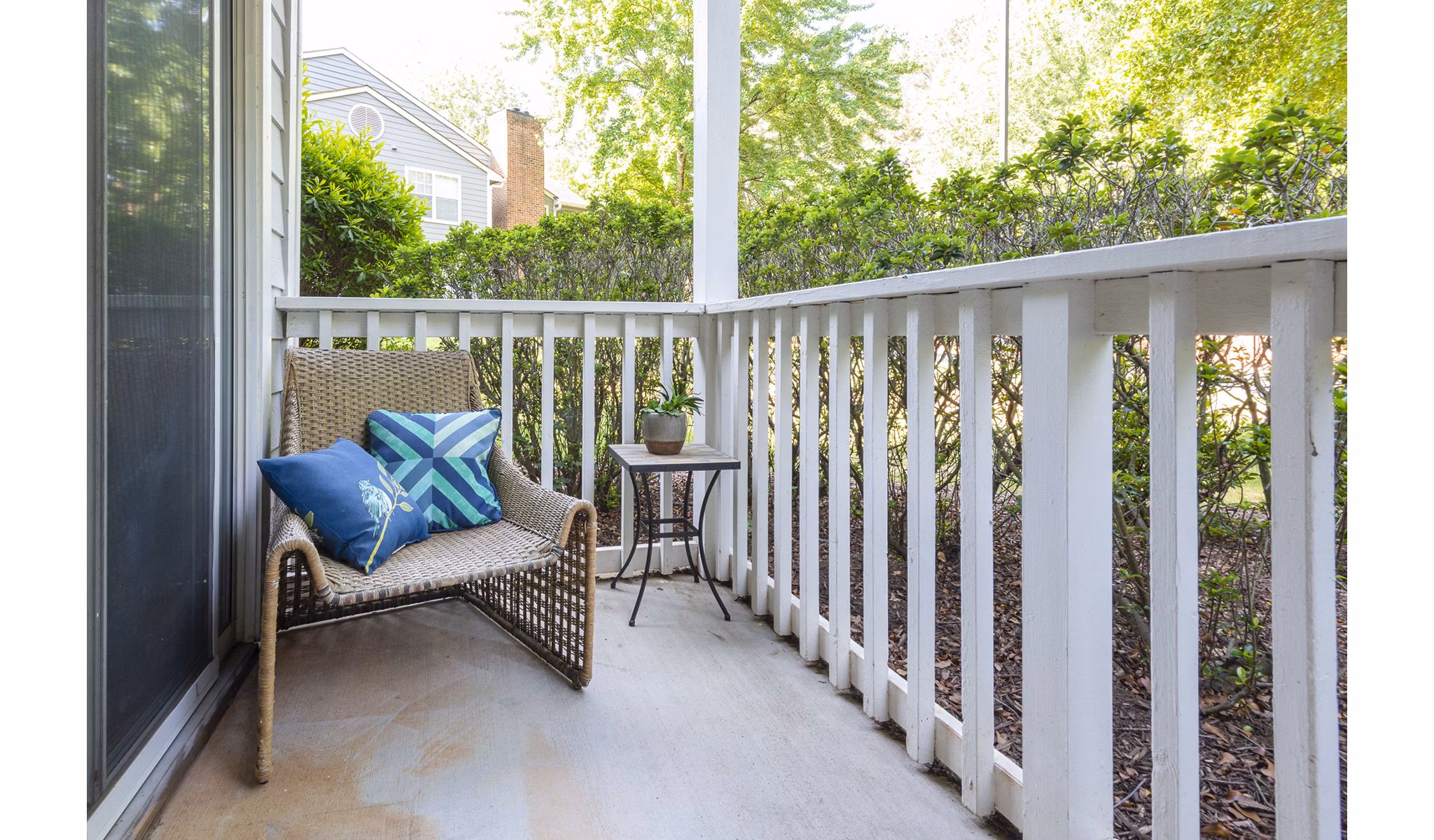 Private patio with modern furniture at Bridgeport Apartments