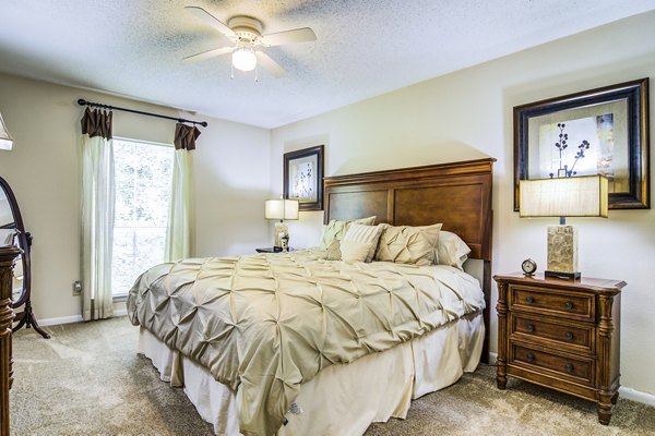 Cozy bedroom with modern decor at Avana Cumberland Apartments