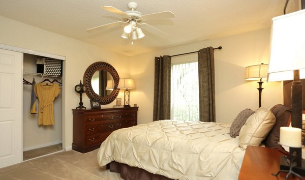 Modern bedroom with sleek furniture and plush bedding at Avana Cumberland Apartments