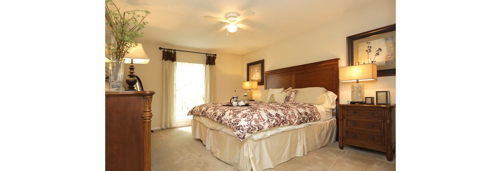 Modern bedroom with serene color palette at Avana Cumberland Apartments, featuring large windows and stylish decor for luxury living