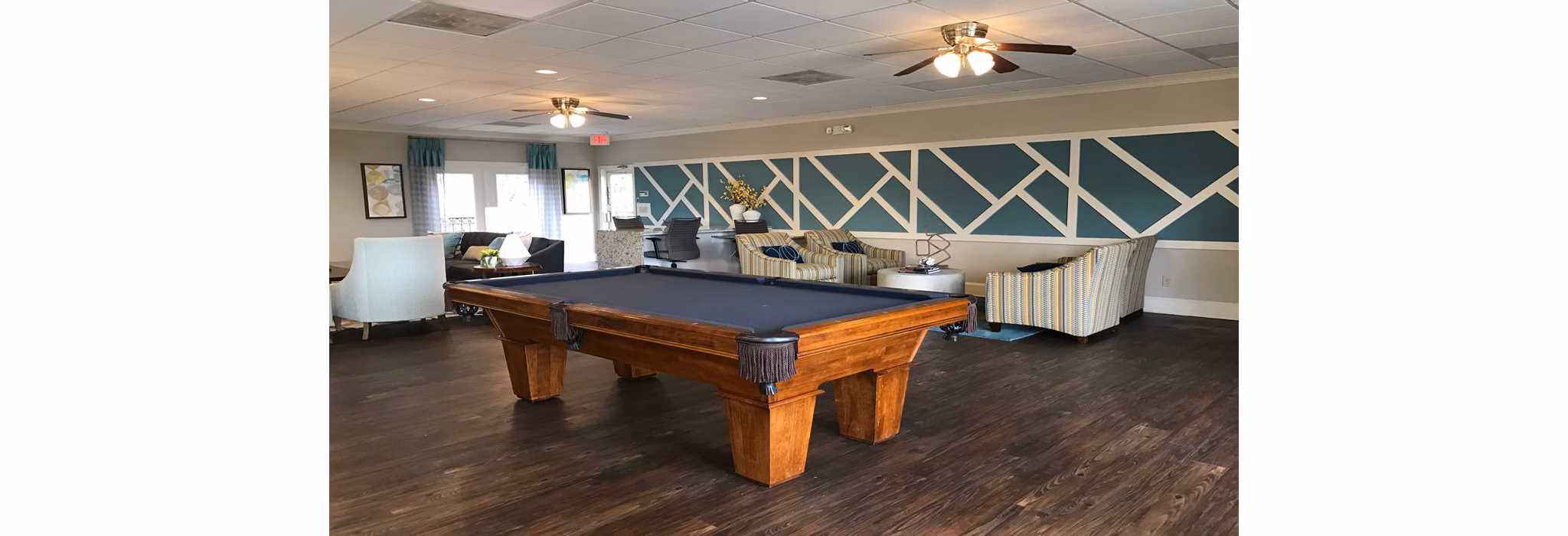 Clubhouse with modern design and cozy seating at Avana Cumberland Apartments