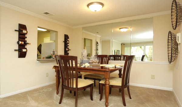 Contemporary dining area with elegant decor in Avana Cumberland Apartments, providing a stylish entertainment space