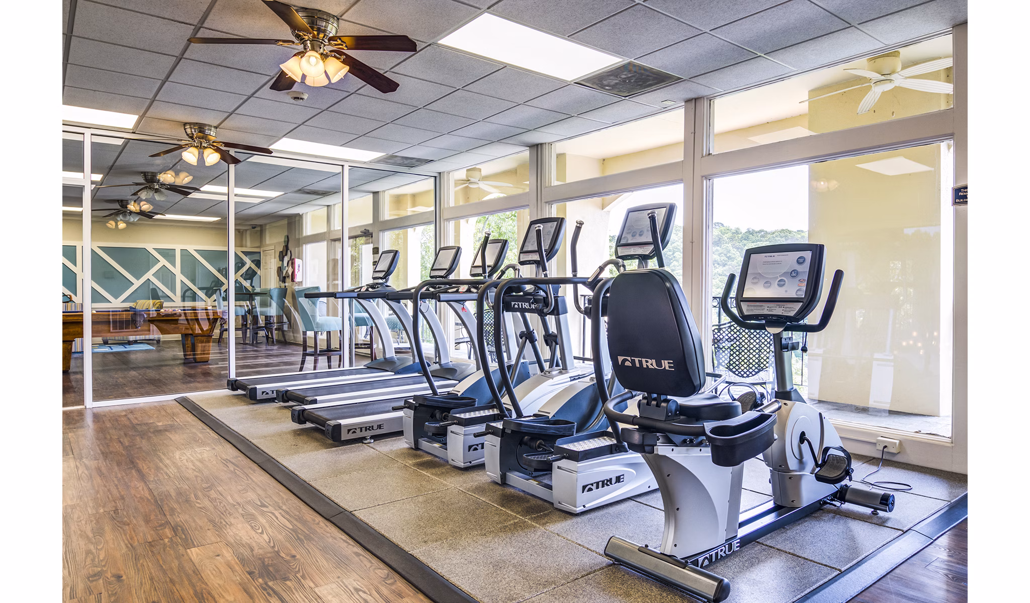 Fitness center equipped with modern gym machines at Avana Cumberland Apartments