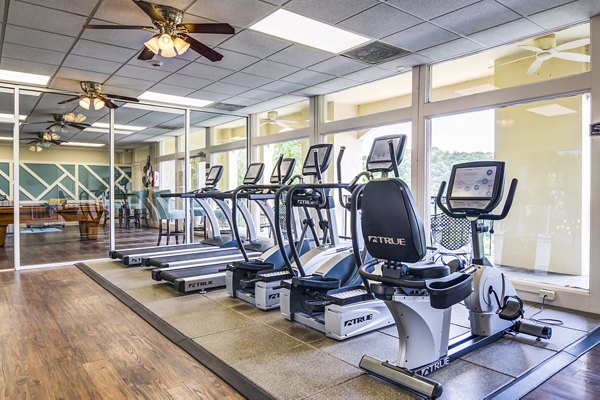Fitness center equipped with modern gym machines at Avana Cumberland Apartments