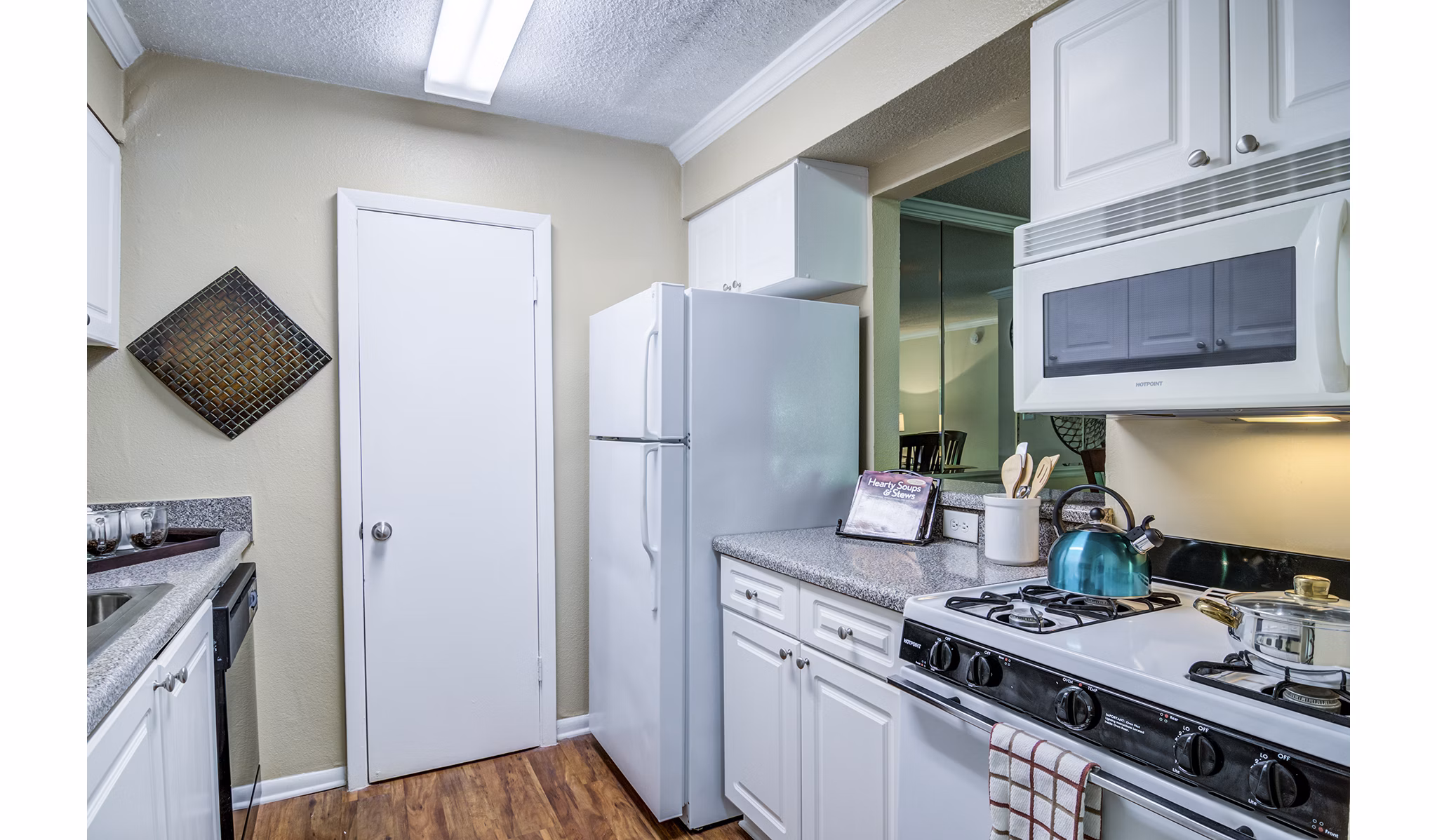 Modern kitchen with stainless steel appliances at Avana Cumberland Apartments