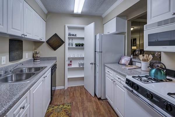 Modern kitchen featuring stainless steel appliances at Avana Cumberland Apartments
