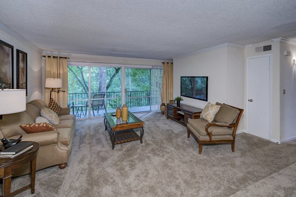 Elegant living room with modern decor and natural light at Avana Cumberland Apartments