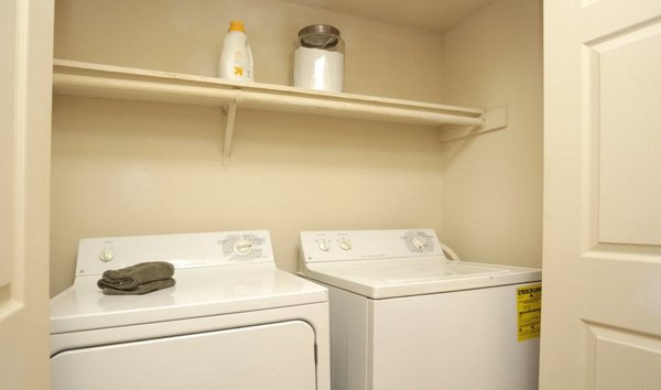 Laundry room with modern appliances in Avana Cumberland Apartments