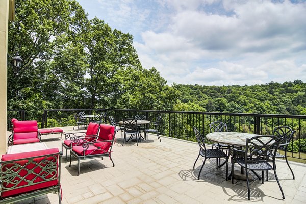 Cozy patio with outdoor seating at Avana Cumberland Apartments, ideal for relaxation and entertainment