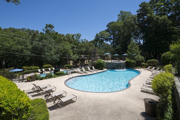 Resort-style pool with lounge chairs at Avana Cumberland Apartments, offering a luxurious retreat in Atlanta