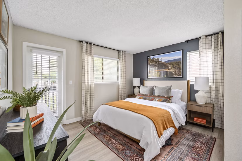 Cozy bedroom with elegant decor in Tuscan Heights Apartments, showcasing luxury living in the Greystar community