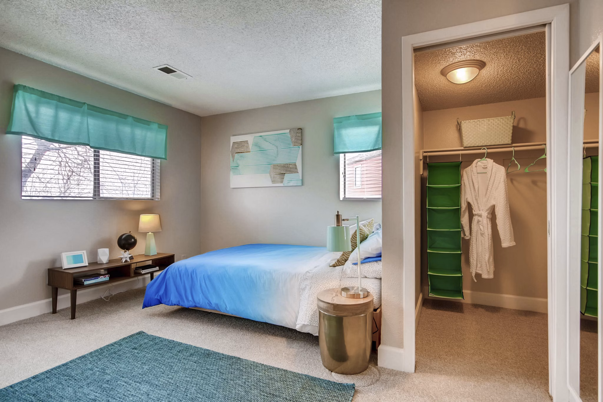 Cozy bedroom with elegant decor in Tuscan Heights Apartments, showcasing luxury living in the Greystar community
