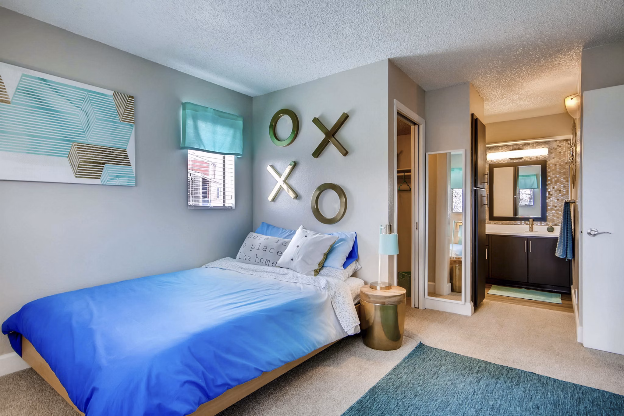 Cozy bedroom with modern decor and natural lighting at Tuscan Heights Apartments