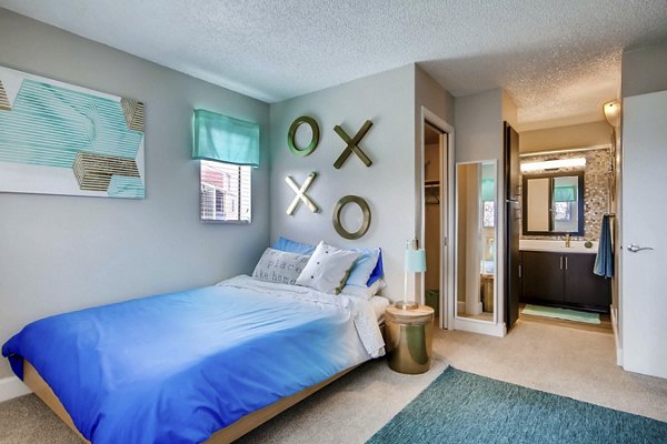 Cozy bedroom with modern decor and natural lighting at Tuscan Heights Apartments