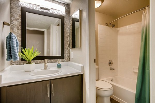 Modern bathroom with double vanity and stylish fixtures at Tuscan Heights Apartments