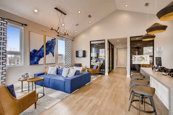 Tuscan Heights Apartments: Stylish clubhouse with modern decor and seating area