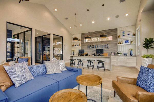 Clubhouse with modern decor and cozy seating at Tuscan Heights Apartments, a luxury community by Greystar