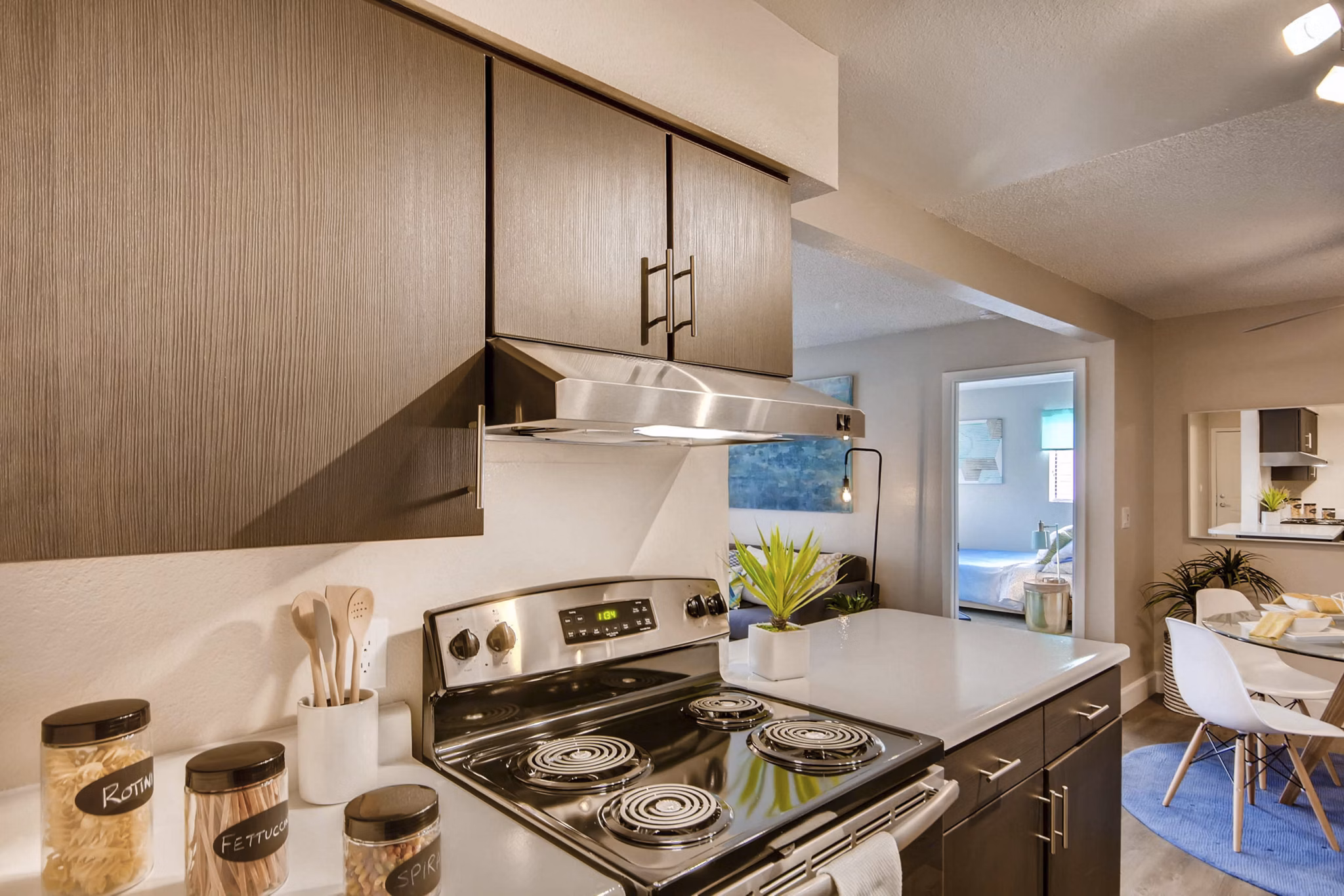 Tuscan Heights Apartments: Modern kitchen with stainless steel appliances and granite countertops