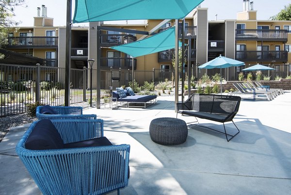 Tuscan Heights Apartments: Spacious patio with elegant outdoor seating, perfect for relaxation in a luxury apartment setting